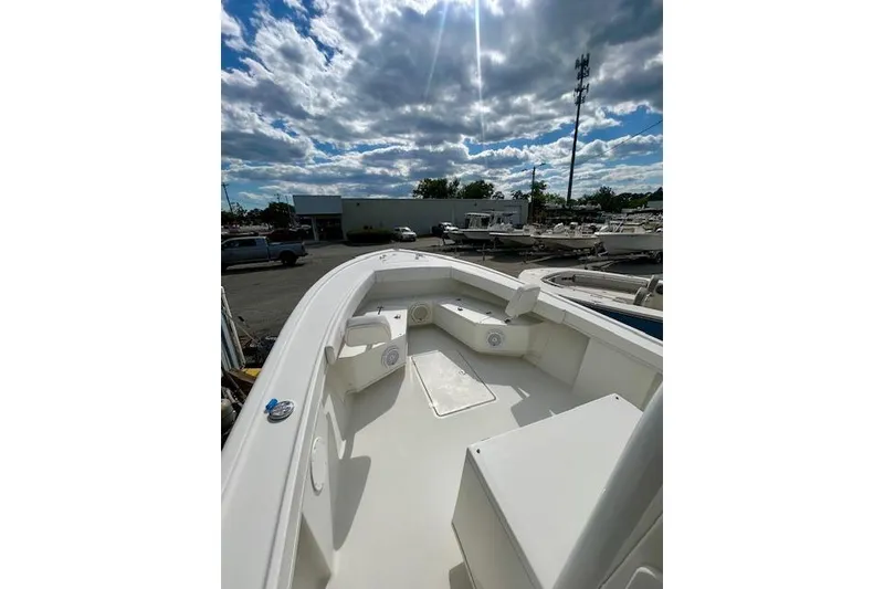 Slide: The Image of 2020 Pair Customs 24 Center Console MV boat under a partly cloudy sky. - 8