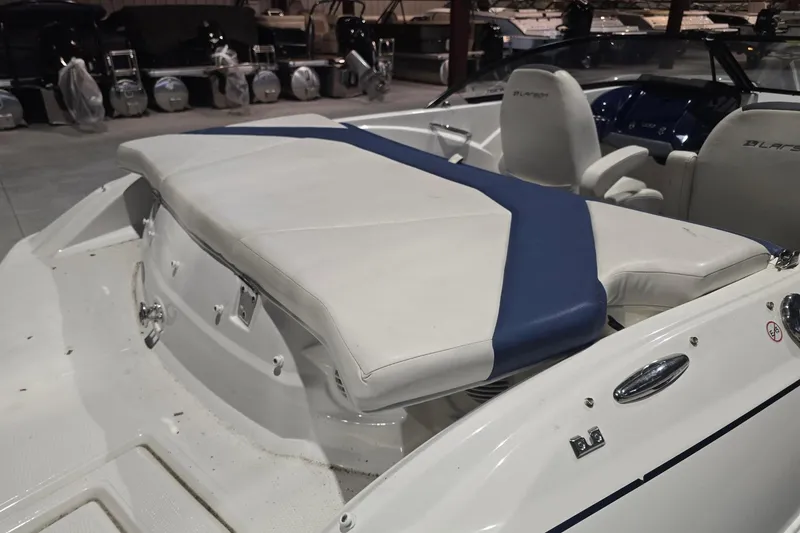 Slide: The Image of 2018 Larson LX 195 I/O boat propeller on gravel surface. - 11