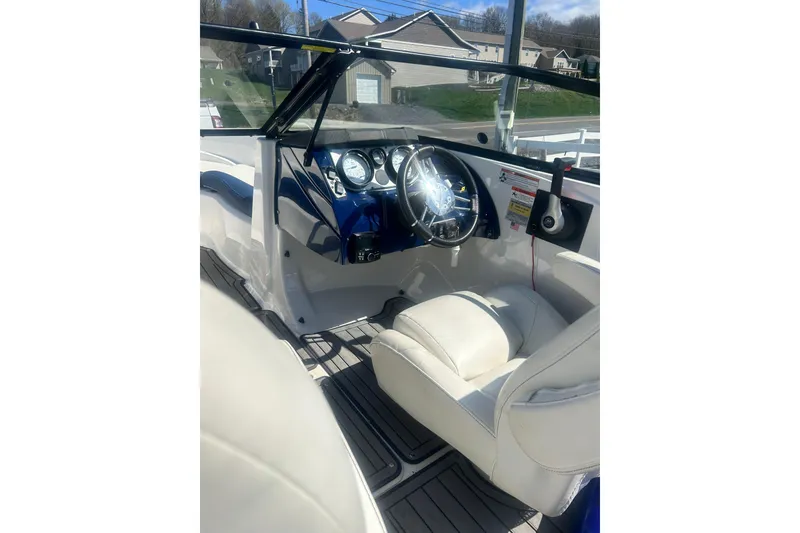 Slide: The Image of Engine compartment of a 2018 Larson LX 195 I/O boat, featuring a 4.5L engine. - 13