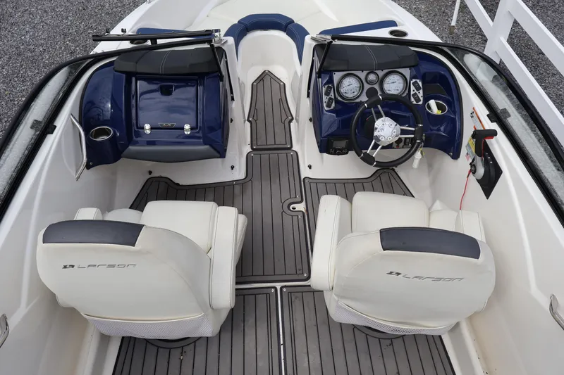 Slide: The Image of Interior view of 2018 Larson LX 195 I/O boat with dual seats and dashboard. - 15
