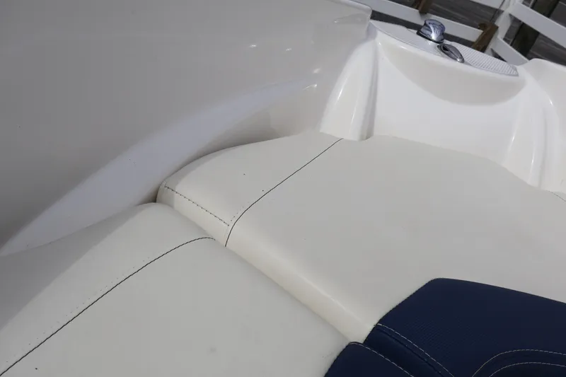 Slide: The Image of White and blue seating on a 2018 Larson LX 195 I/O boat. - 16