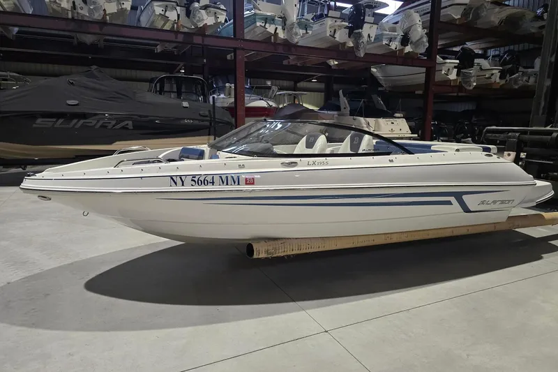 Slide: The Image of 2018 Larson LX 195 I/O boat on trailer with registration number NY 5664 MM. - 2