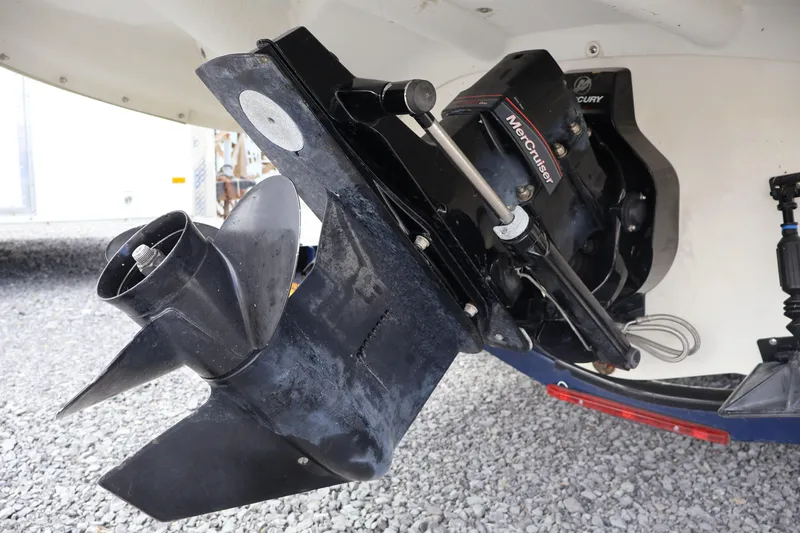 Slide: The Image of 2018 Larson LX 195 I/O boat with MerCruiser outdrive on gravel surface. - 28