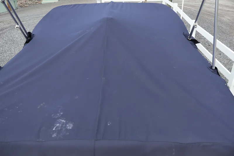 Slide: The Image of Covered Larson LX 195 I/O boat, 2018 model, with navy blue tarp. - 30