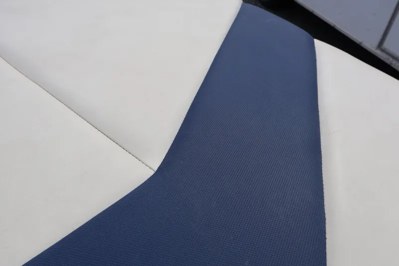 Slide: The Image of Blue and white upholstery detail on 2018 Larson LX 195 I/O boat seat. - 31