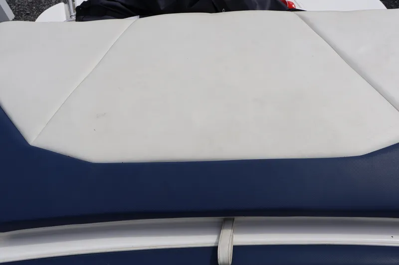 Slide: The Image of White and blue upholstery on a 2018 Larson LX 195 I/O boat seat. - 32