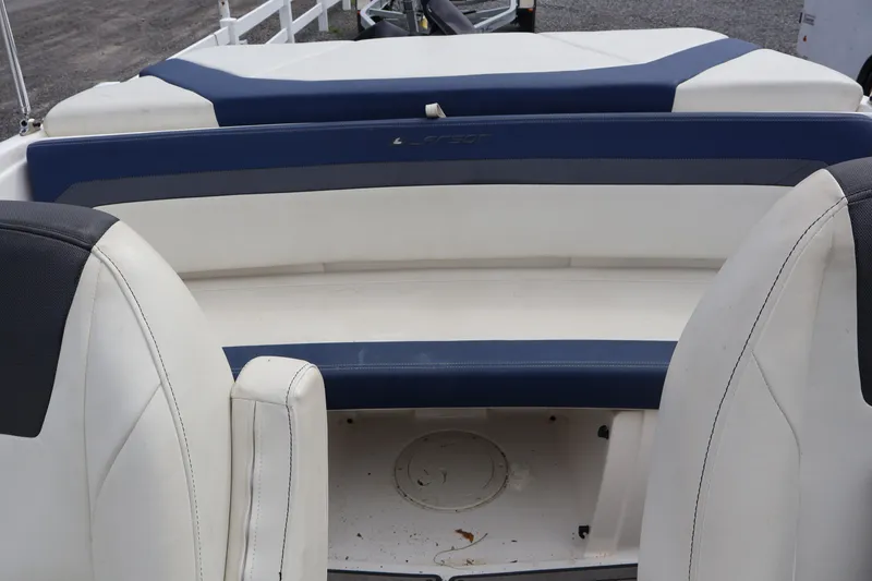 Slide: The Image of 2018 Larson LX 195 I/O boat interior with blue and white seating. - 35