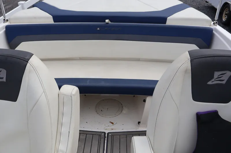 Slide: The Image of 2018 Larson LX 195 I/O boat interior with white and blue seating. - 36