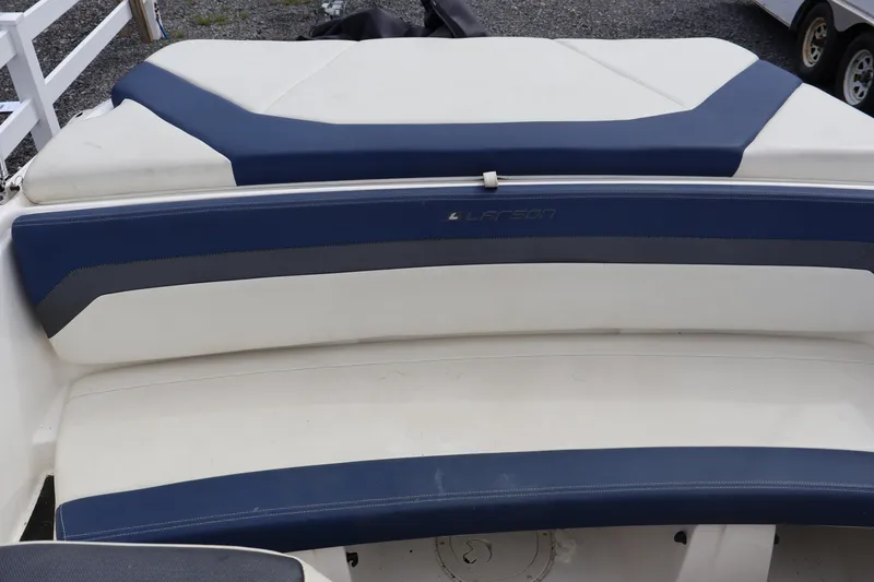 Slide: The Image of 2018 Larson LX 195 I/O boat interior with blue and white seating. - 37