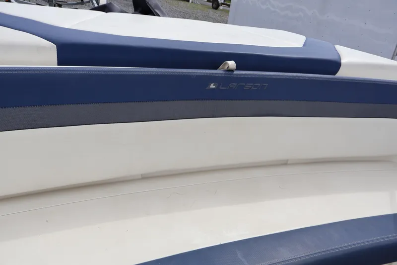 Slide: The Image of 2018 Larson LX 195 I/O boat interior with blue and white seating. - 38