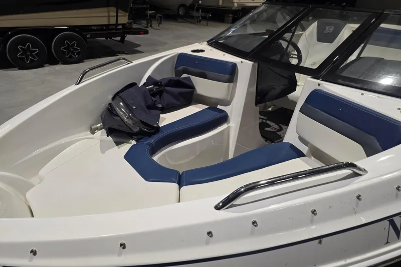 Slide: The Image of 2018 Larson LX 195 I/O boat rear view with swim platform and ladder. - 4