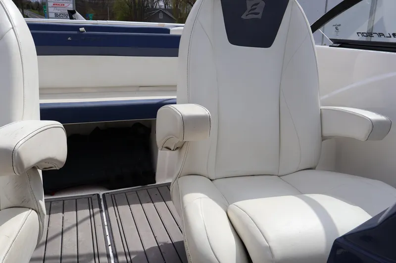 Slide: The Image of White leather seats on a 2018 Larson LX 195 I/O boat interior. - 42