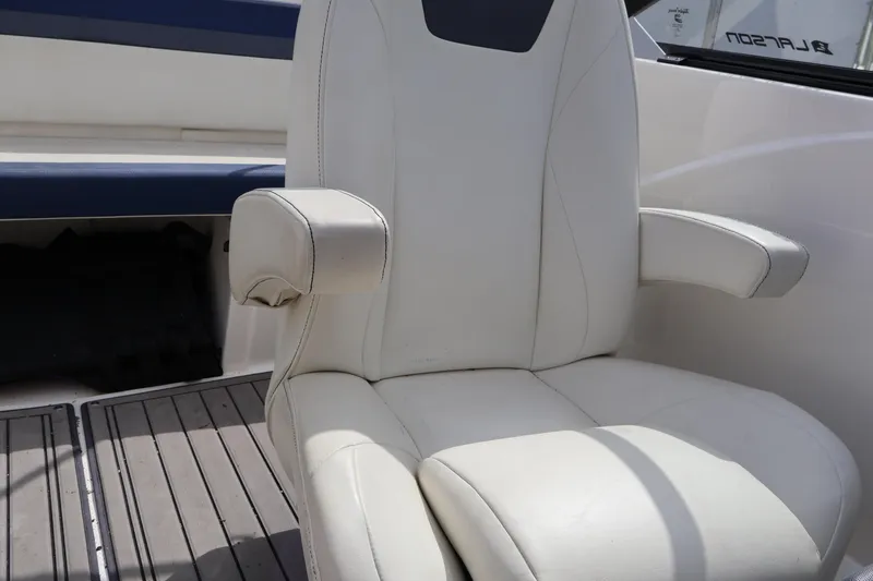 Slide: The Image of White leather seat on 2018 Larson LX 195 I/O boat interior. - 43