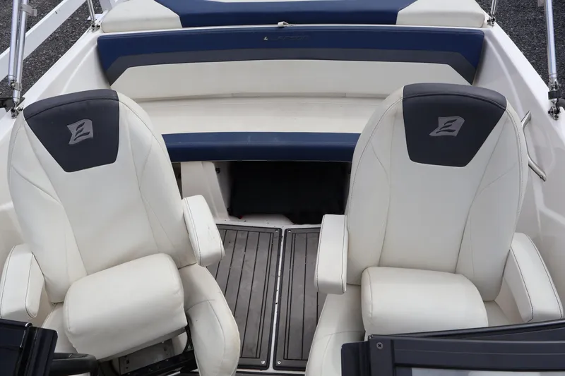 Slide: The Image of 2018 Larson LX 195 I/O boat interior with two white captain's chairs. - 45