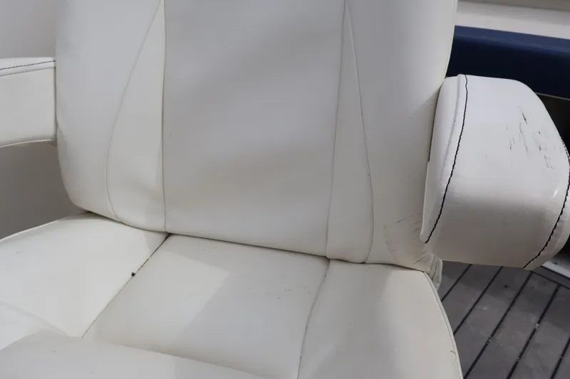 Slide: The Image of White leather seat with armrest on 2018 Larson LX 195 I/O boat. - 48
