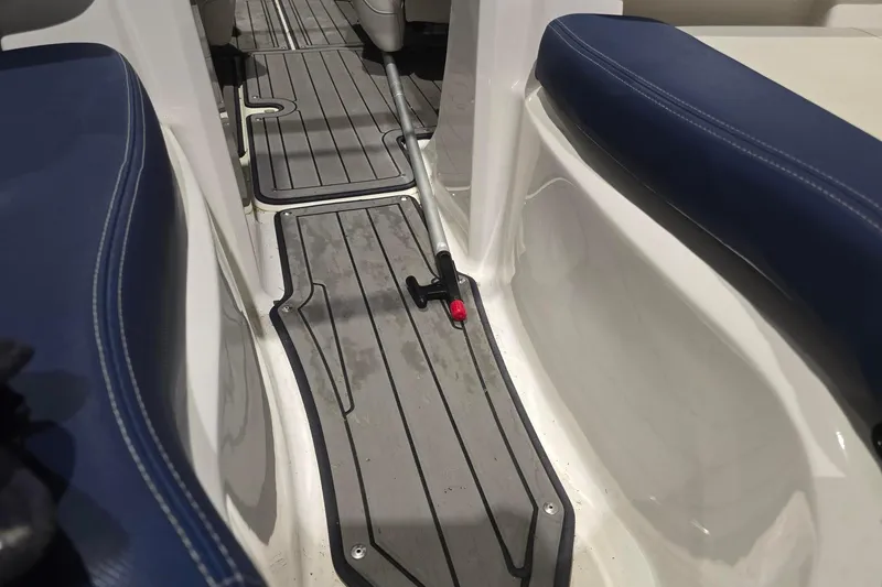 Slide: The Image of 2018 Larson LX 195 I/O boat on trailer, parked outdoors. - 5