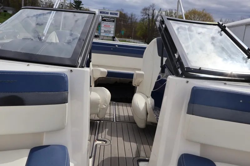 Slide: The Image of Interior view of a 2018 Larson LX 195 I/O boat with blue and white seating. - 54
