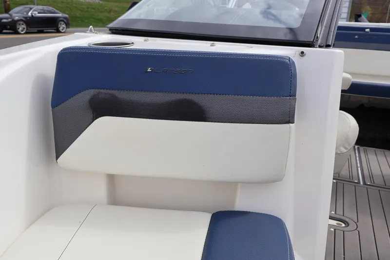 Slide: The Image of 2018 Larson LX 195 I/O boat seat with blue and white upholstery. - 57
