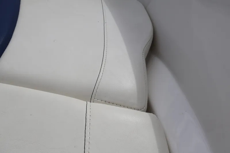 Slide: The Image of White leather seating detail on 2018 Larson LX 195 I/O boat. - 58