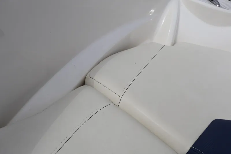 Slide: The Image of 2018 Larson LX 195 I/O boat interior with white cushioned seating. - 59