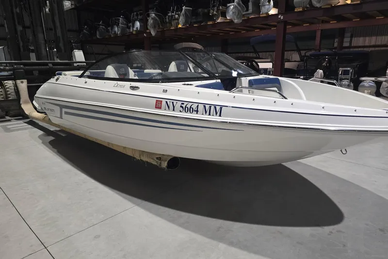 Slide: The Image of 2018 Larson LX 195 I/O boat on trailer, rear view with cover. - 6