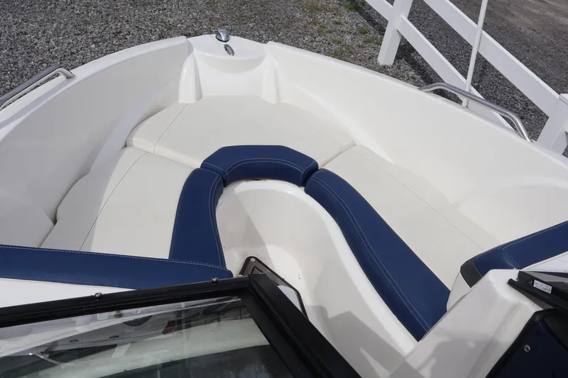 Slide: The Image of 2018 Larson LX 195 I/O boat interior with white and blue seating. - 60