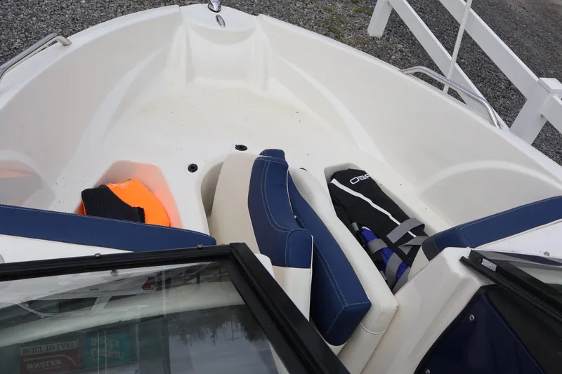 Slide: The Image of 2018 Larson LX 195 I/O boat interior with life jackets and seating. - 61