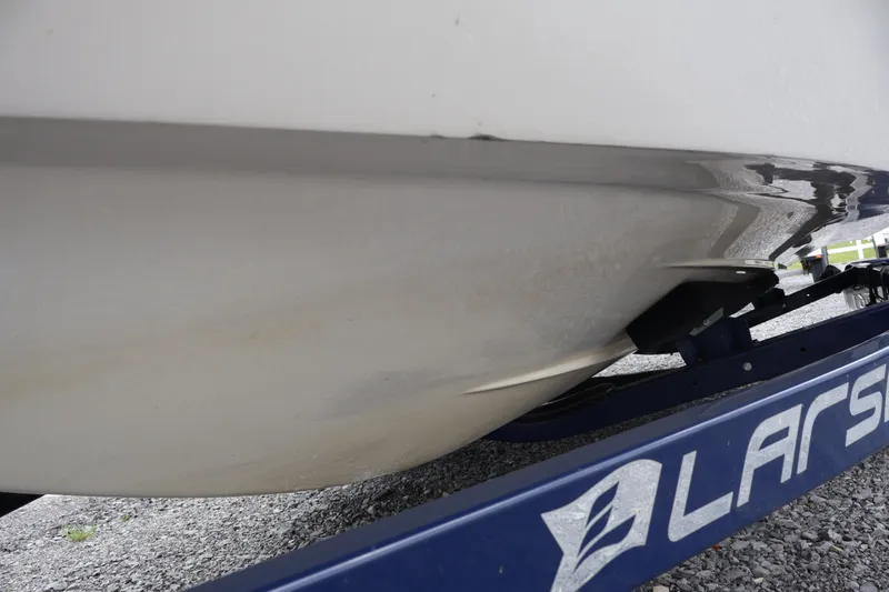 Slide: The Image of 2018 Larson LX 195 I/O boat hull on trailer, close-up view. - 63