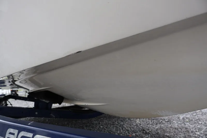 Slide: The Image of 2018 Larson LX 195 I/O boat hull on trailer, close-up view. - 64