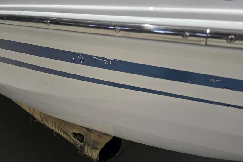 Slide: The Image of 2018 Larson LX 195 I/O boat hull on trailer, close-up view. - 7