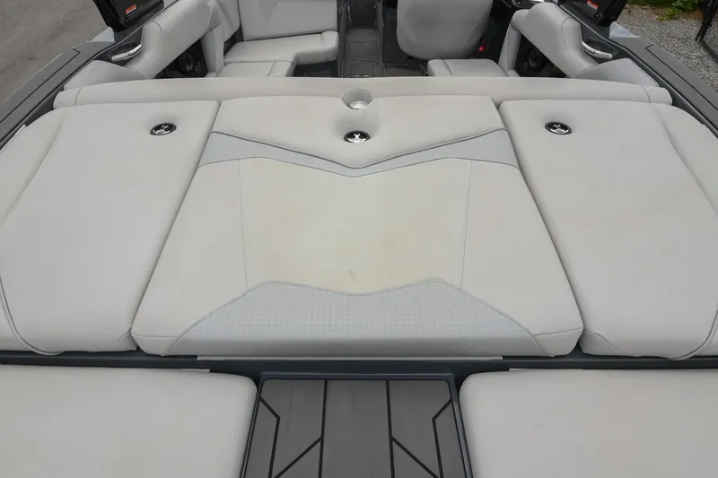 Slide: The Image of 2024 Supreme S220 boat interior with sleek, cushioned seating and modern design. - 18