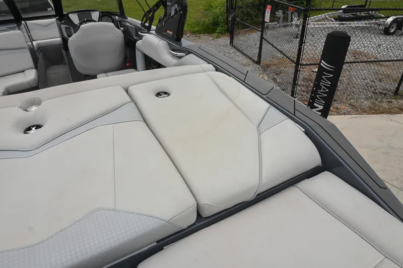Slide: The Image of 2024 Supreme S220 boat interior with sleek seating and modern design. - 19
