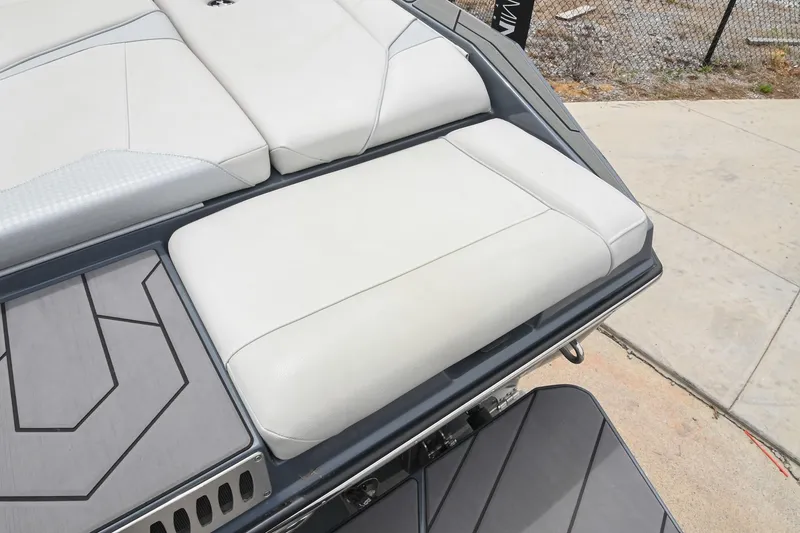 Slide: The Image of 2024 Supreme S220 boat with sleek white seating and modern design. - 21