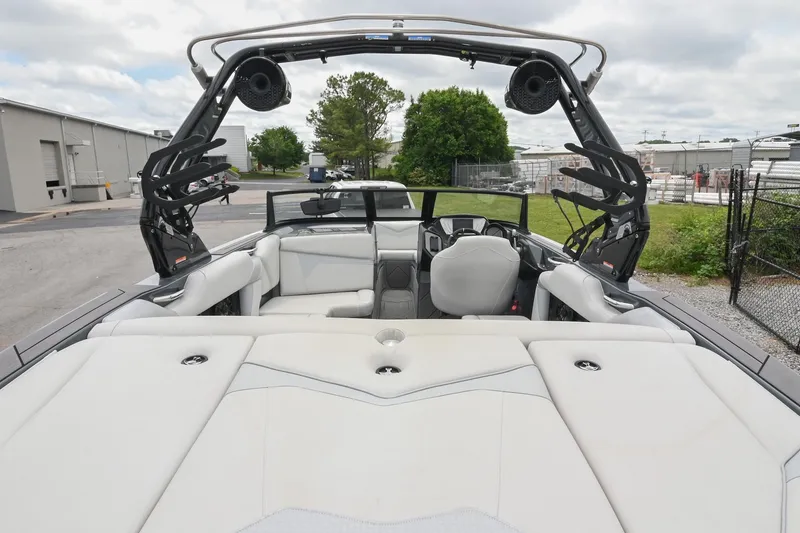 Slide: The Image of 2024 Supreme S220 boat interior with sleek seating and advanced audio system. - 23