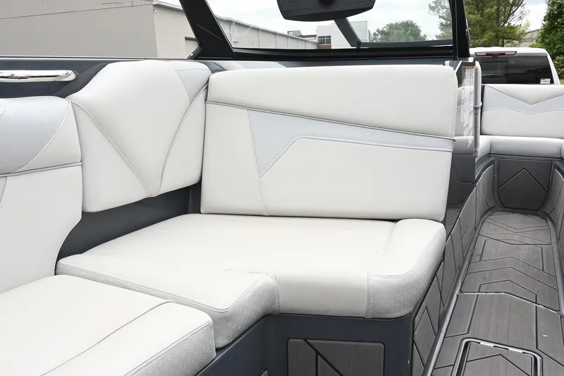 Slide: The Image of 2024 Supreme S220 boat interior with luxurious white seating and modern design. - 32