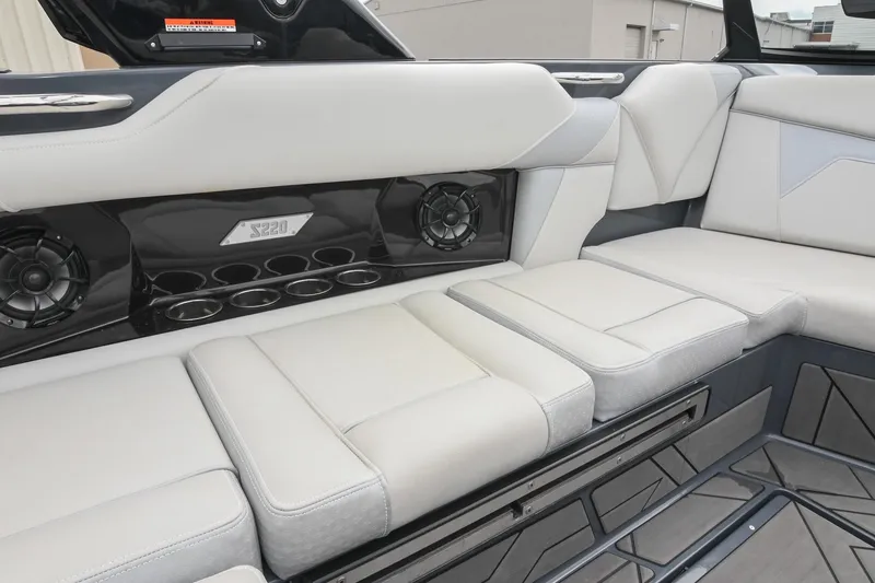 Slide: The Image of Luxurious interior of 2024 Supreme S220 boat with plush seating and built-in speakers. - 34