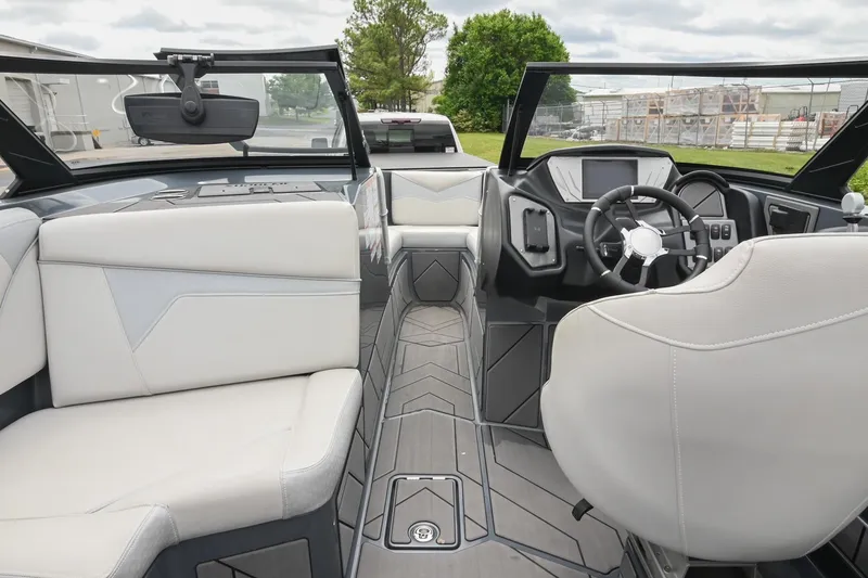Slide: The Image of 2024 Supreme S220 boat interior with modern dashboard and luxurious seating. - 36