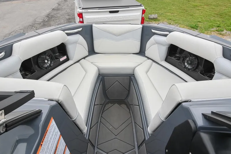 Slide: The Image of 2024 Supreme S220 boat interior with cushioned seating and built-in speakers. - 40