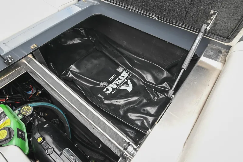 Slide: The Image of 2024 Supreme S220 engine compartment with ballast bag and mechanical components. - 48