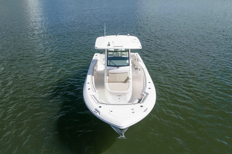 Slide: The Image of 2021 Boston Whaler 330 Outrage boat on calm water, aerial view. - 15
