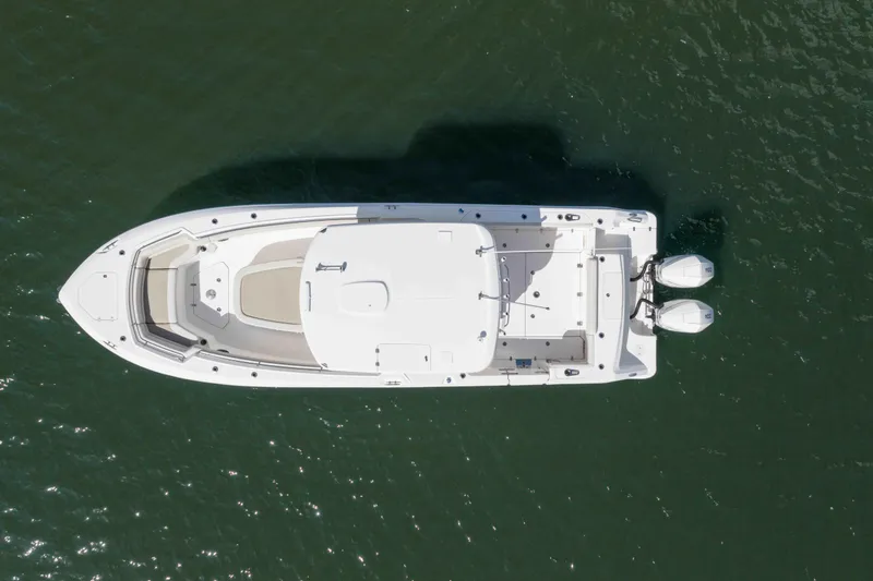 Slide: The Image of Aerial view of 2021 Boston Whaler 330 Outrage boat on water. - 3