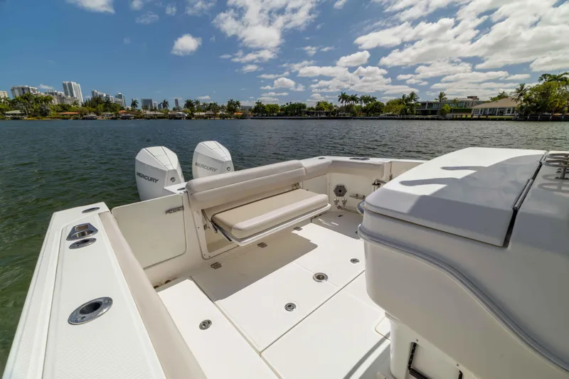 Slide: The Image of 2021 Boston Whaler 330 Outrage boat with dual Mercury engines on a sunny day. - 39