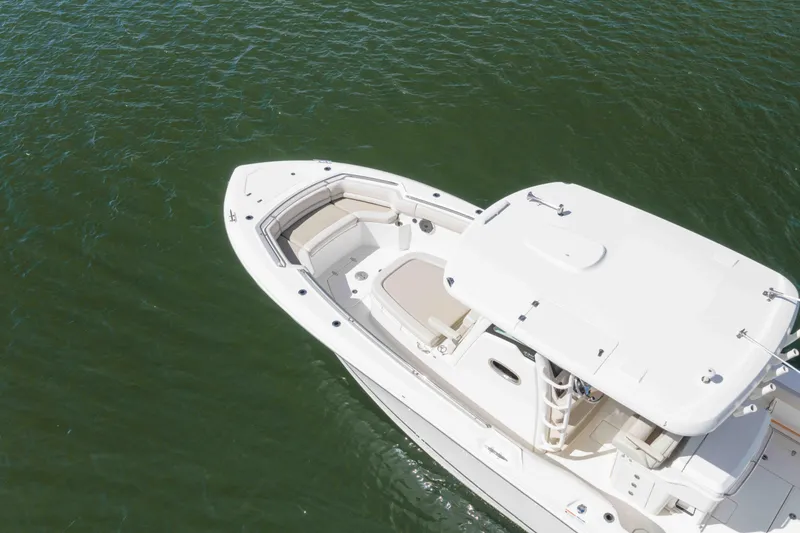Slide: The Image of Aerial view of 2021 Boston Whaler 330 Outrage boat on calm water. - 4