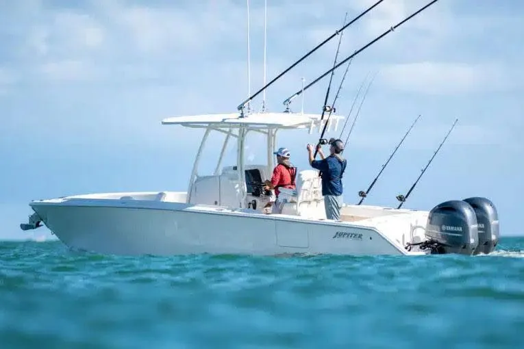 Slide: The Image of Manufacturer Provided Image: 2026 Jupiter 26 boat with anglers fishing, equipped with dual outboard motors. - 5