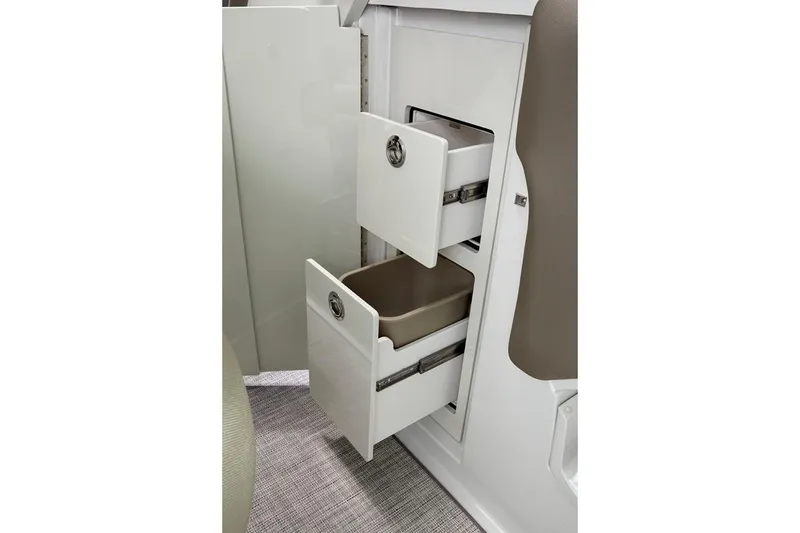 Slide: The Image of 2024 Finseeker by Crownline 280 DC boat interior storage drawers, showcasing sleek design and functionality. - 15