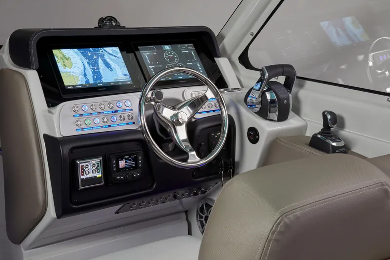 Slide: The Image of 2024 Finseeker by Crownline 280 DC dashboard with advanced navigation and control systems. - 20