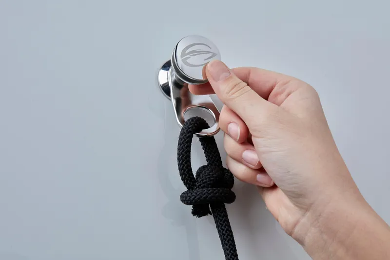 Slide: The Image of Hand securing rope on 2024 Finseeker by Crownline 280 DC fender clip - 28