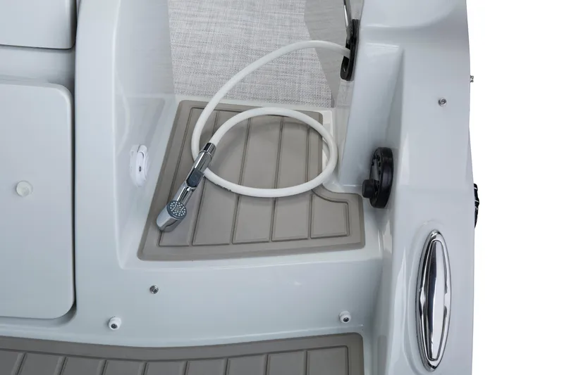 Slide: The Image of 2024 Finseeker by Crownline 280 DC boat deck with shower hose and non-slip surface. - 4