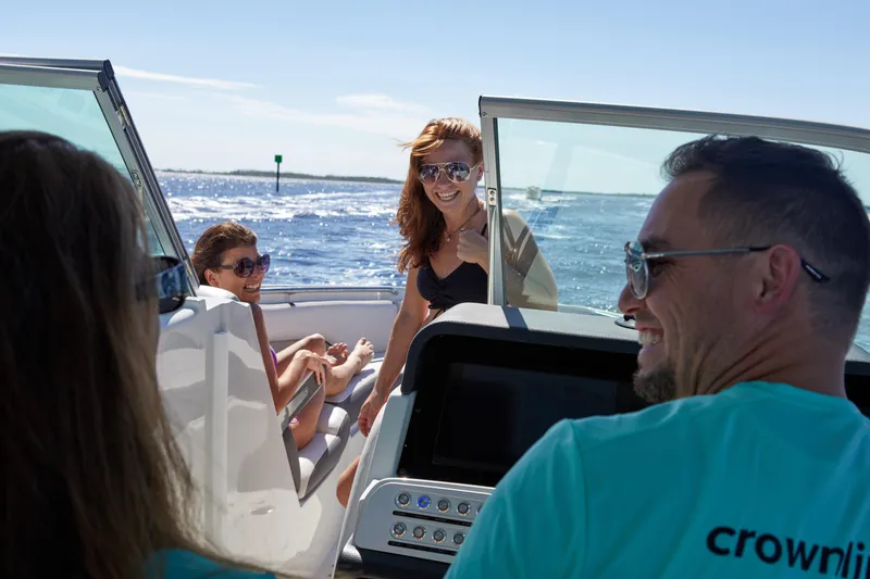 Slide: The Image of People enjoying a sunny day on a 2024 Finseeker by Crownline 280 DC boat. - 40