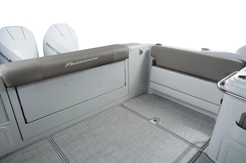 Slide: The Image of 2024 Finseeker by Crownline 280 DC boat interior with seating and dual Mercury engines. - 7